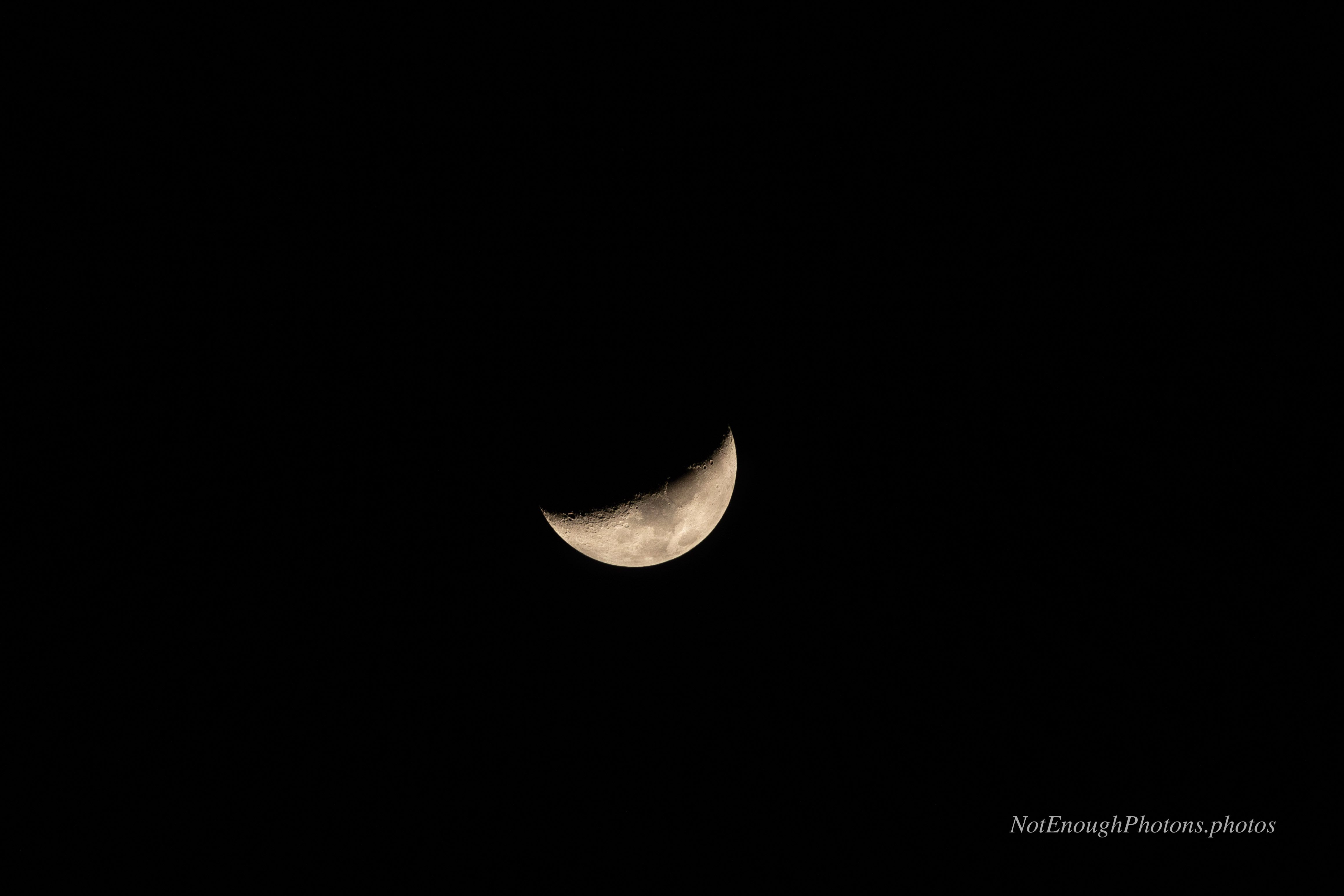the moon, as observed from the Okavango Delta in Botswana a crescent moon